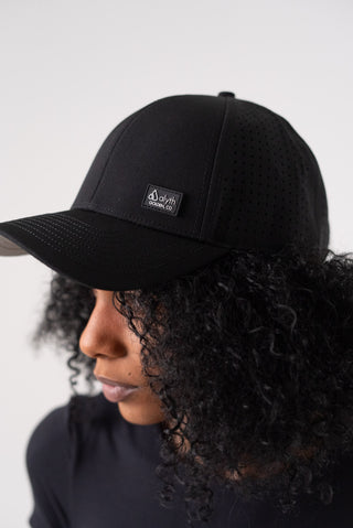 Alyth Active Alyth Waterproof Hat in Black - Women's Workout Clothing Side View