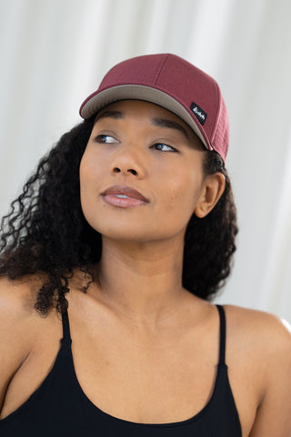 Alyth Active Alyth Waterproof Hat in Deep Rosewood - Women's Workout Clothing Front View