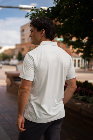 Alyth Active Momentum Polo in Navy - Women's Workout Clothing Side View